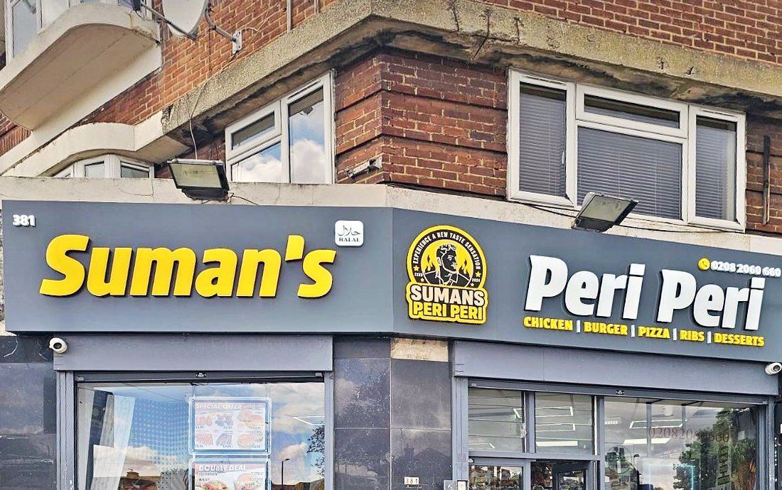 Suman’s Peri Peri corner shop front by day